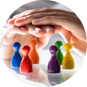 hands over multi colored chess pieces